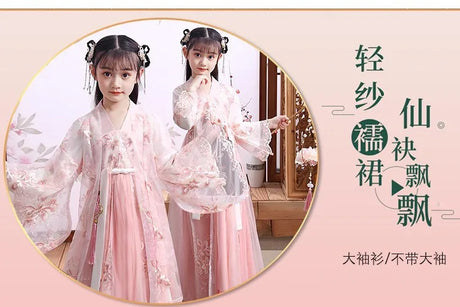 Girls in a pink Chinese Hanfu cosplay dress, showcasing delicate embroidery and flowing sleeves for a fairy-like appearance.