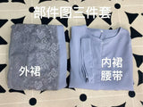 Three-piece grey outfit set featuring an outer layer with lace and a simple inner top with a belt for a stylish look.