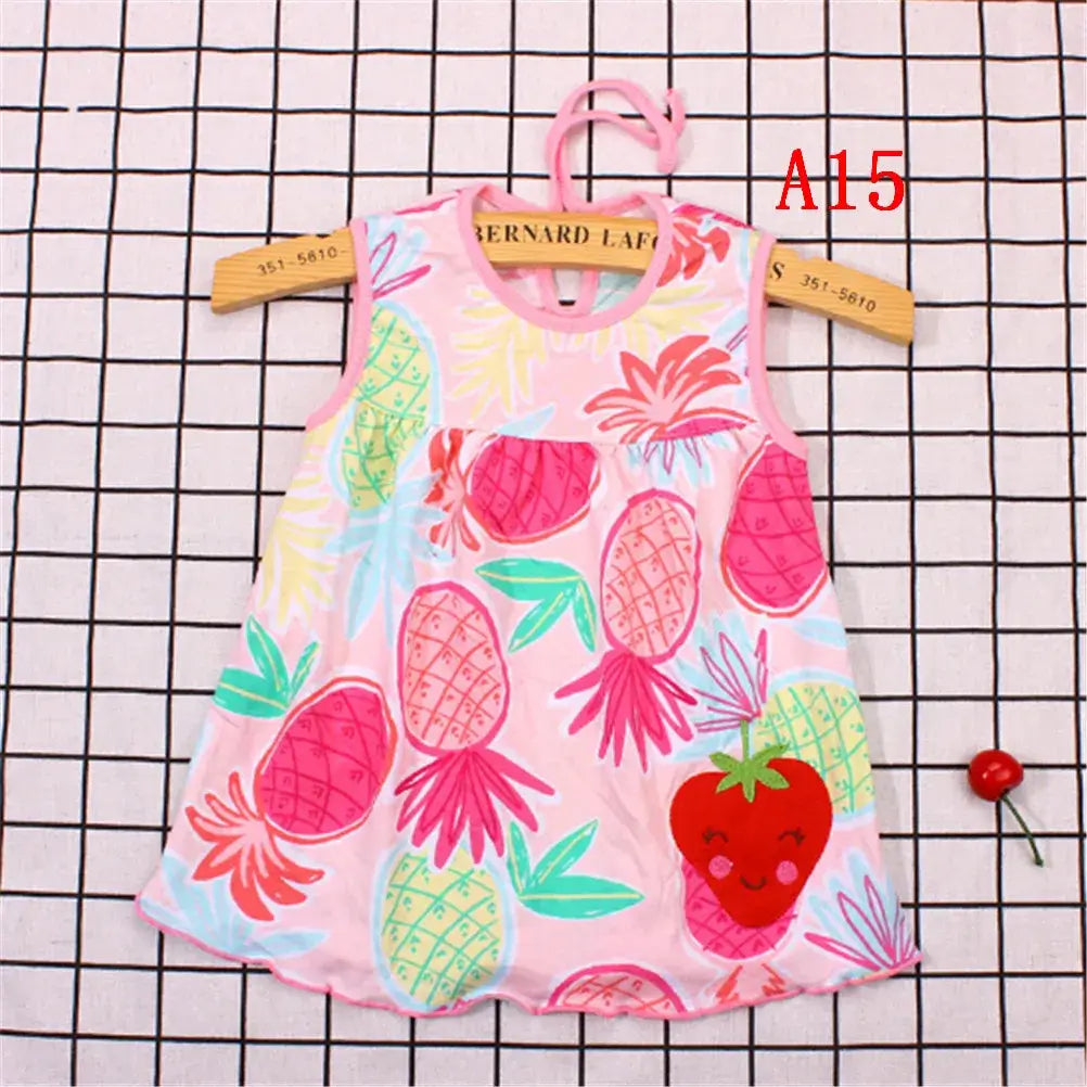 Sleeveless baby dress with colorful pineapple and strawberry print, perfect for summer wear.