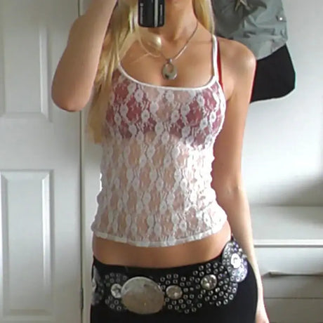 LaceMuse vintage fairycore spaghetti strap top in sheer lace with backless design, worn by a woman.