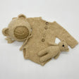 Newborn photo romper with bear bonnet and matching toy set, ideal for unisex newborn photography props.