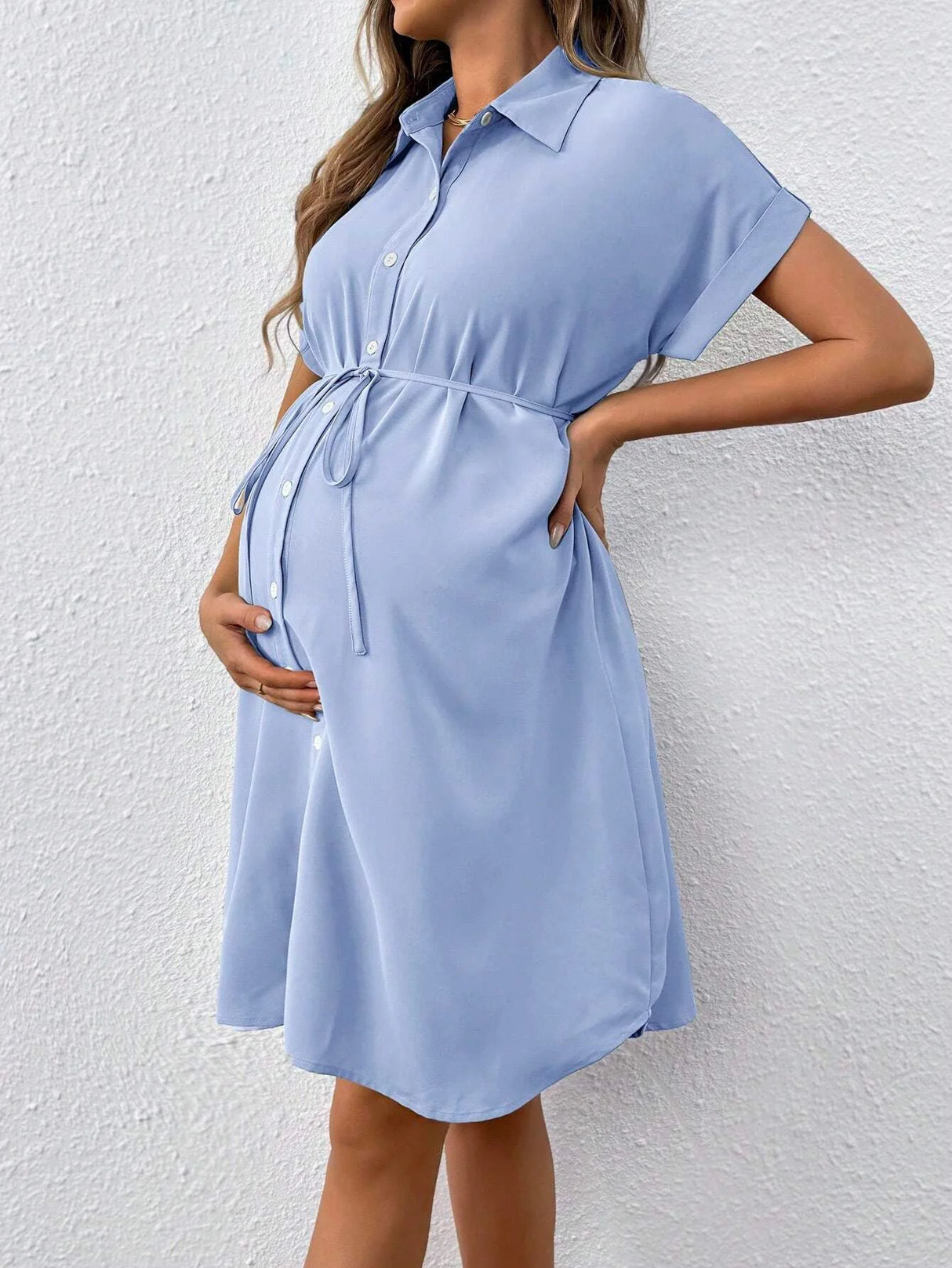 Light blue striped button maternity dress with short sleeves and tie waist, perfect for casual summer outings.