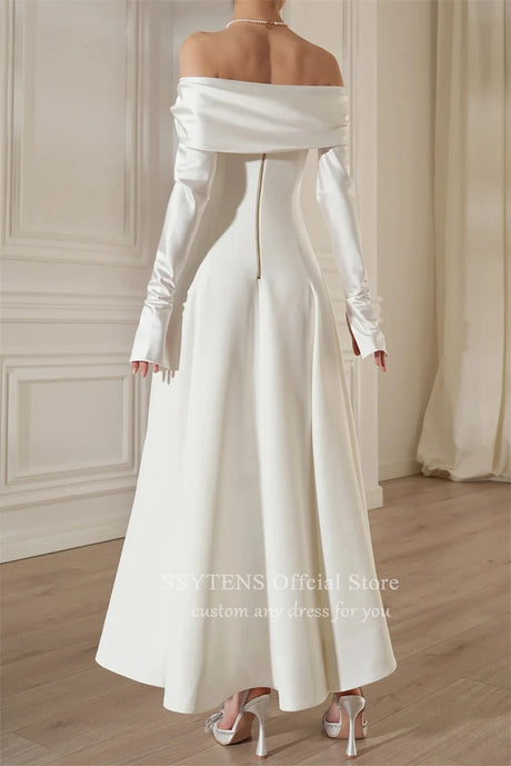 Chic off shoulder satin wedding dress with detachable sleeves, showcasing elegant back zip detail and ankle-length design.