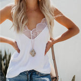 Elegant satin camisole with lace detail, perfect for a stylish outfit, paired with a necklace and casual shorts.