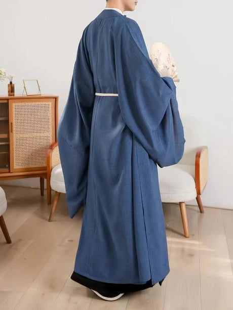 Back view of a unisex Classic Tang Dynasty Hanfu robe in blue, showcasing elegant sleeves and traditional design.