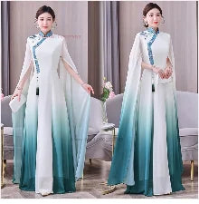 Elegant woman wearing a gradient Hanbok dress with a flowing cape, showcasing traditional Asian fashion.