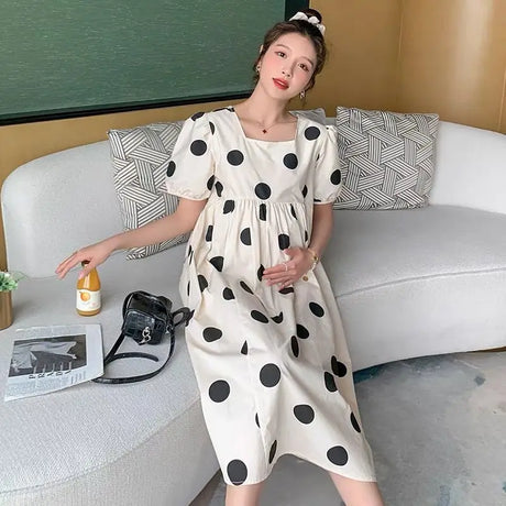 Polka dot loose maternity dress, mid-calf length, stylish summer outfit for women, comfortable cotton blend fabric.