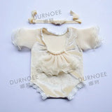 Newborn photography props featuring a soft, stylish beige romper with ruffles and matching headband, ideal for baby photoshoots.