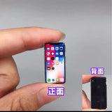 Miniature mobile phone model held in hand, showing front and back screens with realistic app icons.