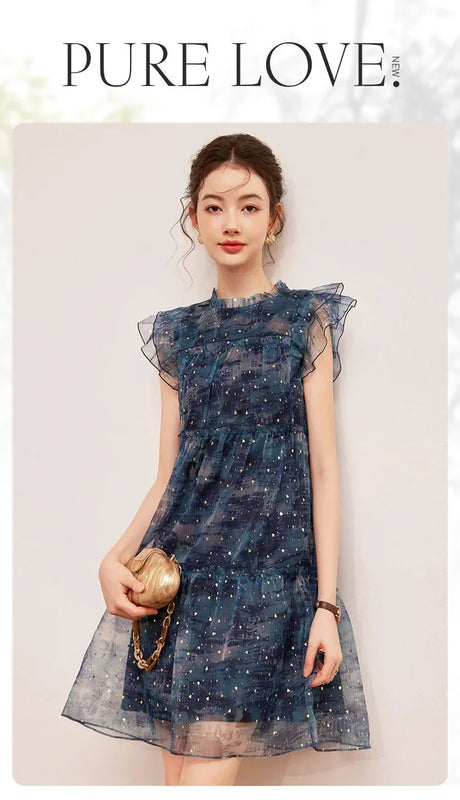 Woman wearing a stylish LOUIS YAO Sparkling Dress featuring flounced edges and a mini length, perfect for summer.