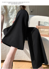 Y2K bootcut maternity pants in black, featuring a wide leg and stylish design, perfect for summer wear.