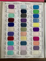 Color swatch chart displaying a variety of fabric shades, including purples, greens, blues, and browns.