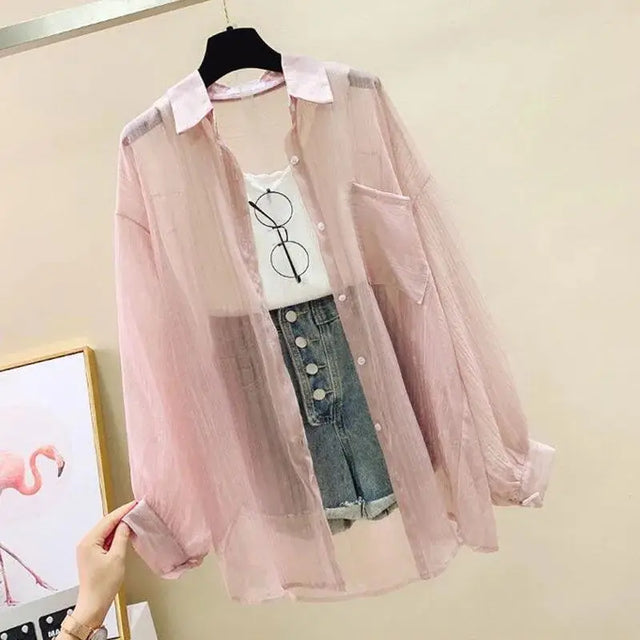 Lightweight sheer chiffon cardigan in light pink, styled over a white tee and denim shorts, perfect for spring and summer.