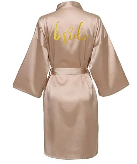 Back view of the Team Bride Gold Letter Satin Kimono Robe in a soft beige color.
