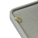 Exquisite newborn baby angel ring in gold, crafted for ages 0-6 months, displayed on a soft gray velvet box.