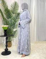 Elegant Dubai Moroccan Kaftan in light gray, showcasing Islamic dress style with floral patterns and open stitch design.