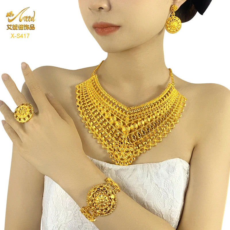Luxury Indian bridal jewelry set featuring a 24K gold plated necklace, earrings, ring, and bracelet for weddings.