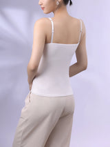 Back view of a woman wearing a Bralux™ built-in bra camisole with adjustable straps in white.