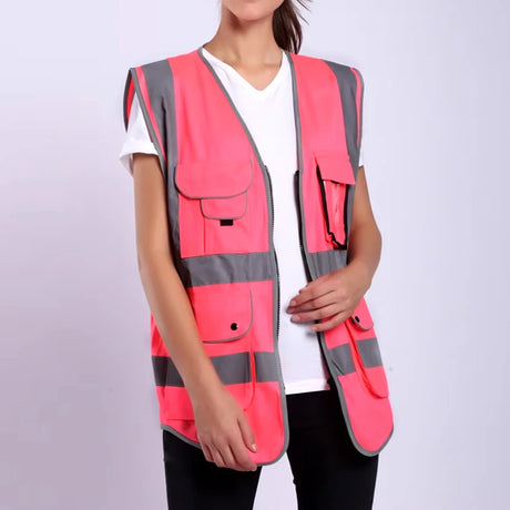 Hi-Vis pink safety vest with multiple pockets and reflective stripes for high visibility and durability in work environments.
