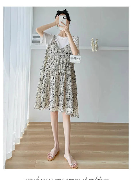 Elegant floral maternity dress with a layered design, perfect for summer baby showers and casual outings.
