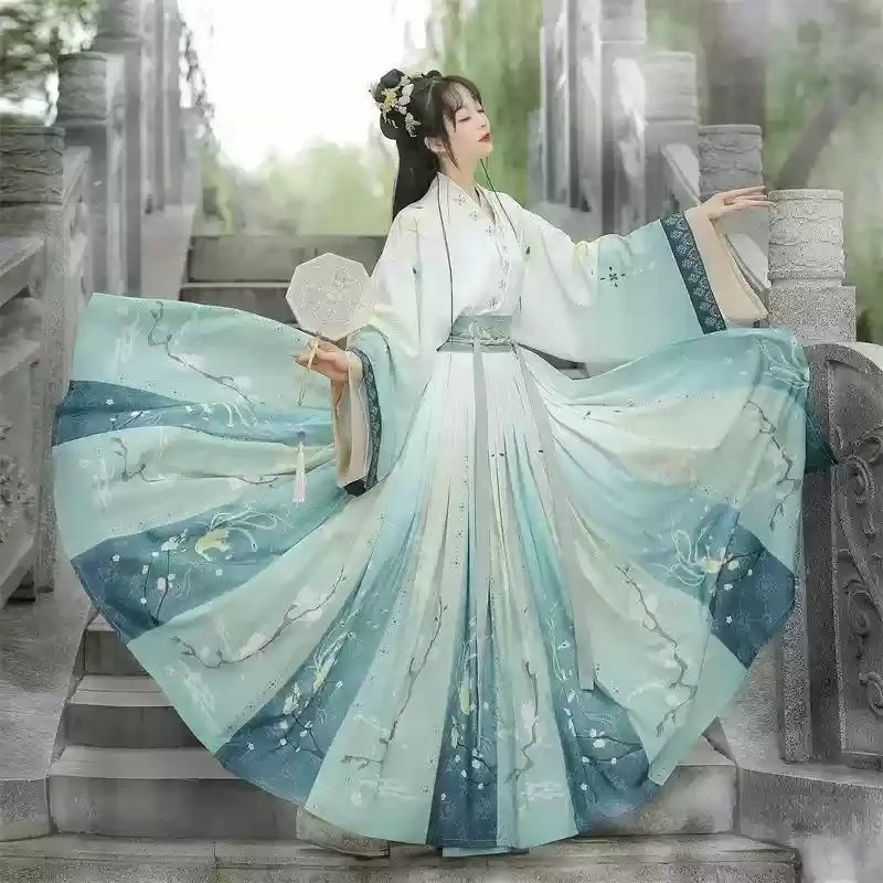 Hanfu traditional dress in light blue with floral patterns, perfect for parties and special occasions.