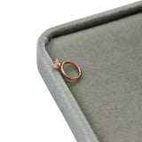 Exquisite newborn baby angel ring in rose gold, perfect for ages 0-6 months, displayed on a soft gray surface.