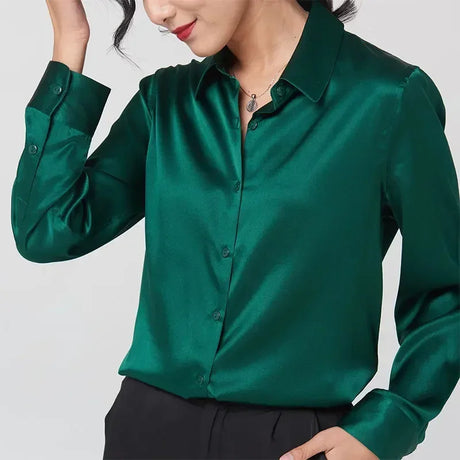 Elegant long sleeve silk shirt in deep green, featuring a button-up front and a V-neck collar, perfect for women.