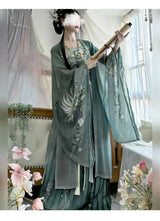 Elegant woman in Song Dynasty Hanfu set, featuring chiffon top and skirt, surrounded by flowers.