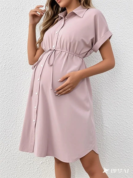 Striped button maternity dress in light pink with a casual summer style, featuring a turn-down collar and adjustable tie.