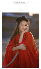 Woman in a traditional red Hanfu dress smiling radiantly, showcasing Chinese cultural cosplay.