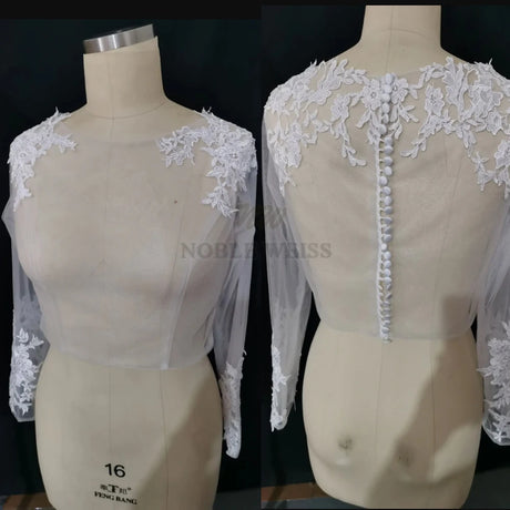 Lace bridal bolero with long sleeves and scoop neckline, featuring intricate appliqué detailing on the shoulders.