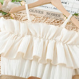 Girls casual dress with one-line shoulder straps and ruffled design in cream color, perfect for summer outings.