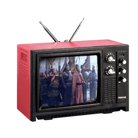 Vintage red and black television with antennas displaying a historical scene.