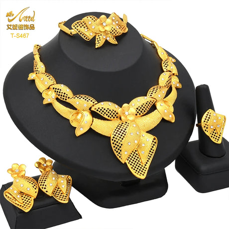 Luxury Indian bridal jewelry necklace set in 24K gold, featuring intricate floral designs, earrings, and bracelet.