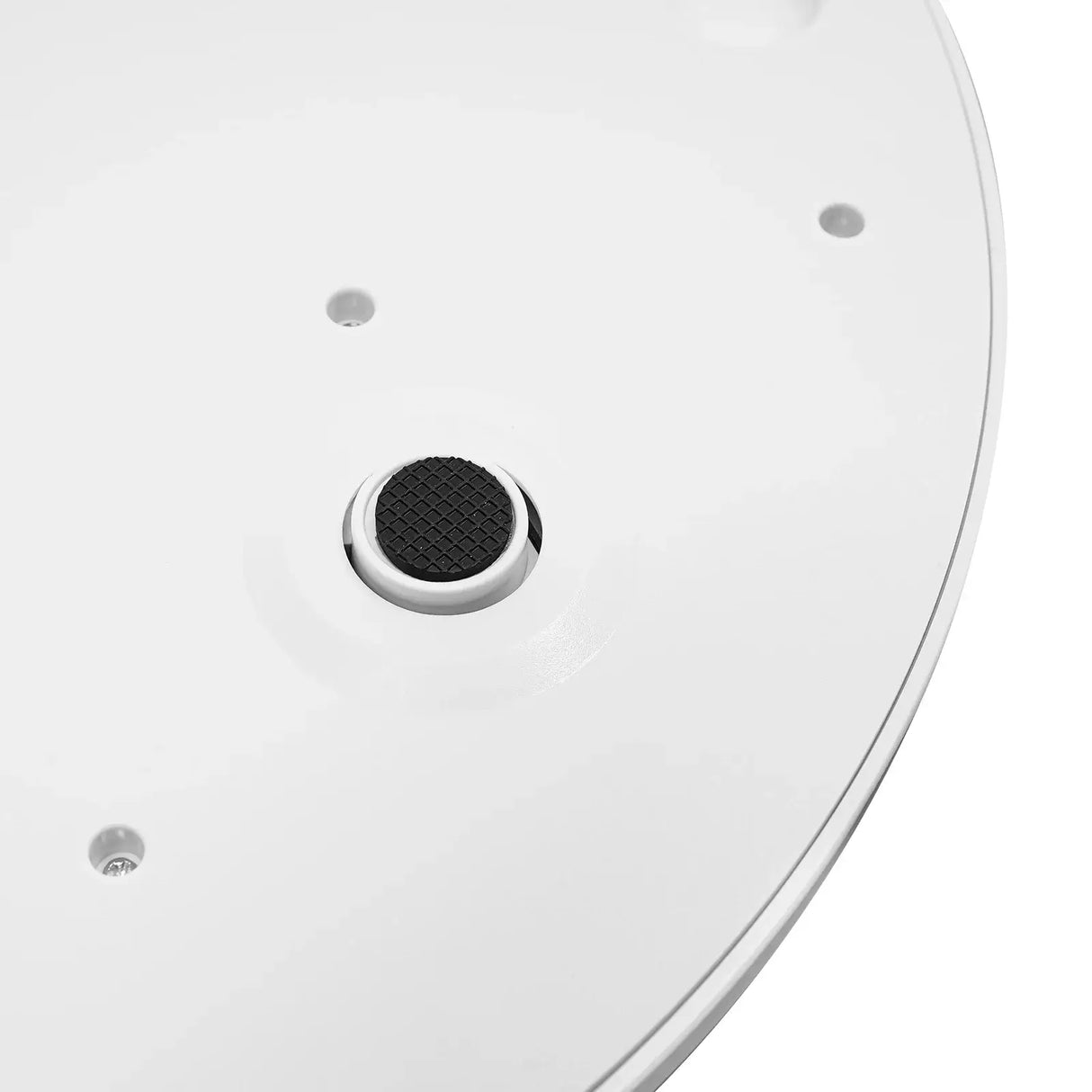 Close-up of the base of an ergonomic digital baby scale showing the non-slip rubber foot for stability.