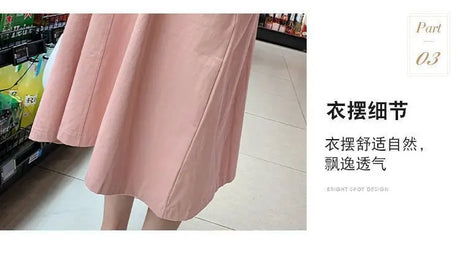 Close-up of pink Korean loose fit maternity dress, showcasing its flowy mid-calf design and soft fabric.