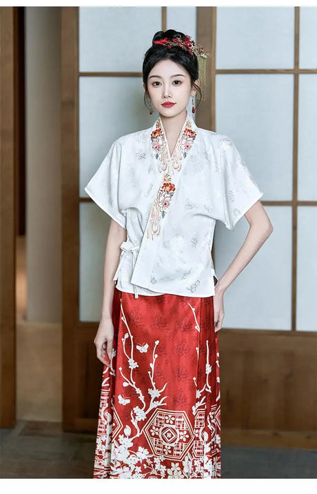 Traditional Hanfu oversized embroidered blouse in white, paired with a red skirt, showcasing elegant Asian fashion.