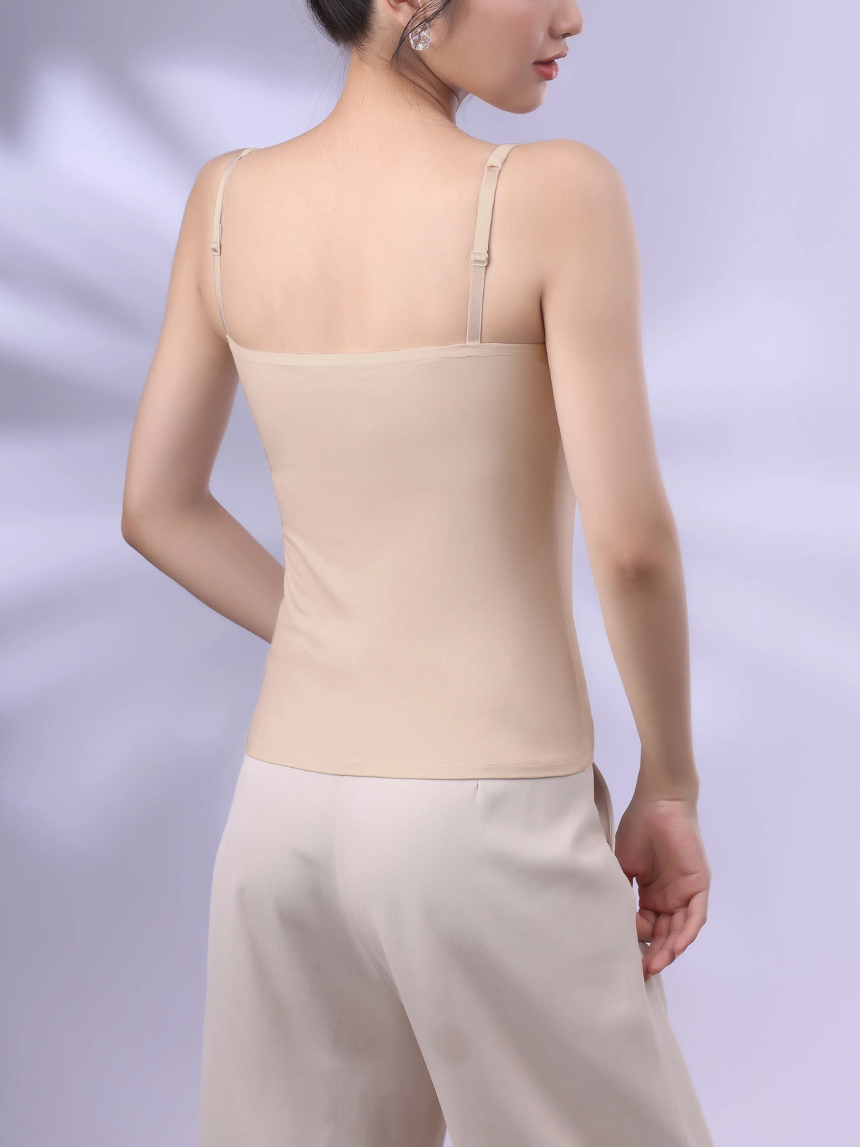 Back view of Bralux™ adjustable strap camisole in soft beige fabric, designed for women with a comfortable inner layer.