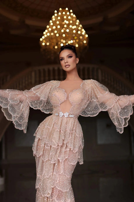 Elegant Arab nude stone wedding gown with tiered sleeves and beaded detailing, perfect for special occasions.