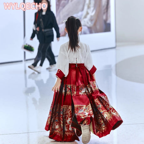 Young girl wearing a traditional embroidered summer Hanfu dress, walking elegantly in a modern setting.