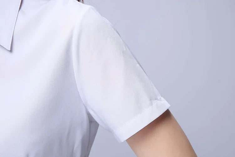Close-up of a white short sleeve shirt with a turn-down collar and a slim fit design.