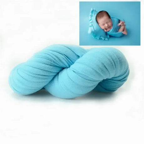 Soft blue polyester blanket for baby photo shoots, featuring a stylish twist design and ideal for newborn photography.