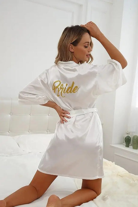 Elegant satin bridal robe featuring 'Bride' design, perfect for brides and bridal showers.
