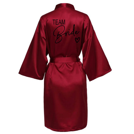 Team Bride satin robe in burgundy, featuring elegant black lettering and a stylish kimono design.
