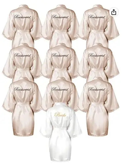 Bridesmaid and Bride satin robes displayed together in a chic arrangement, perfect for weddings and special occasions.