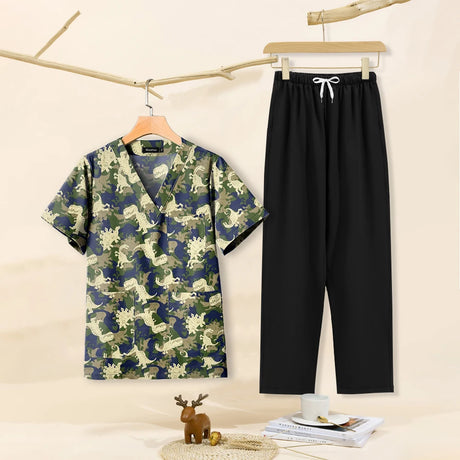 Cartoon print dental scrubs for women, featuring a V-neck top and black pants, perfect for pet grooming workwear.