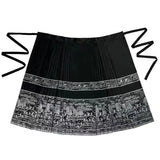 Traditional horse face skirt in black with intricate patterns, designed for women, crafted from polyester.