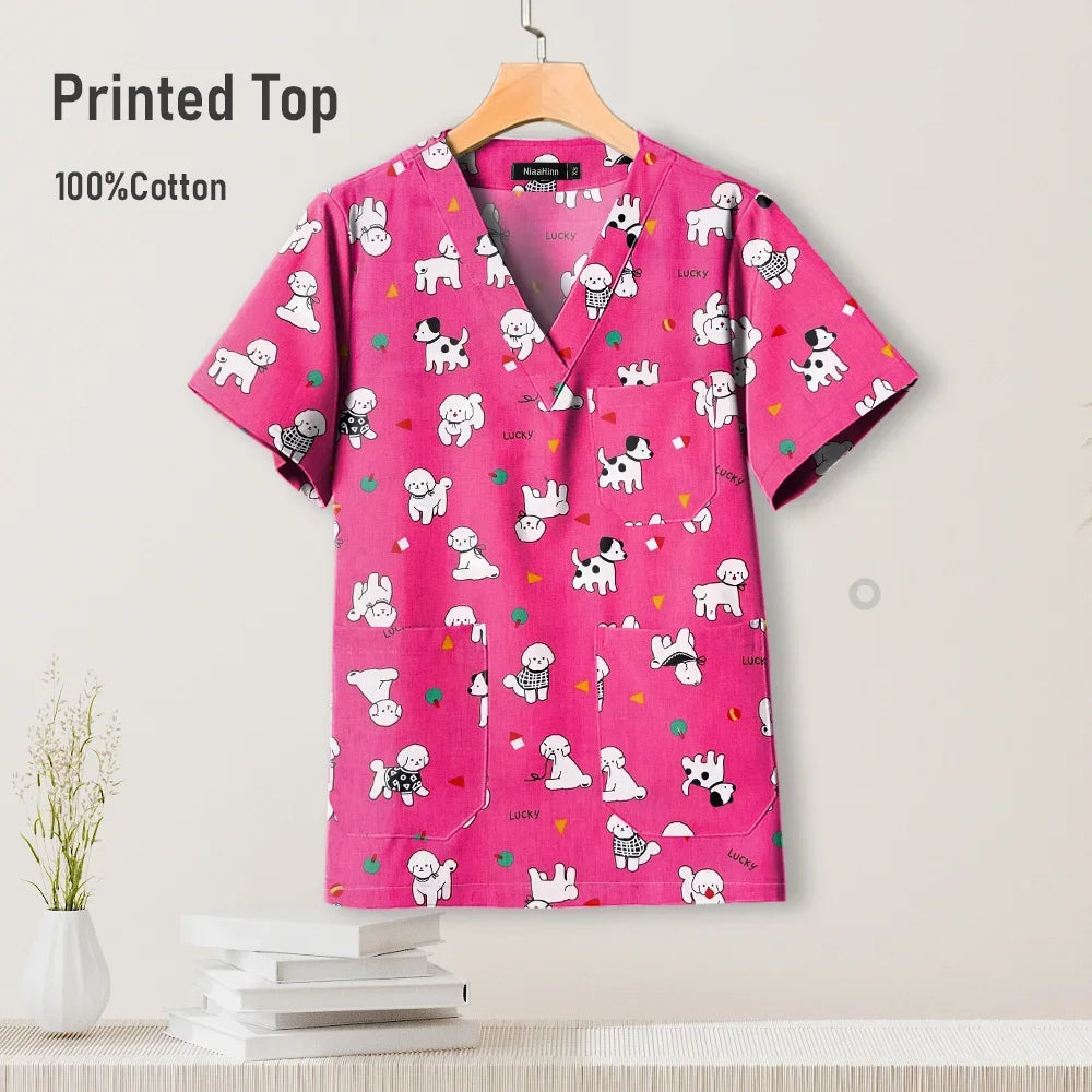 Colorful pediatric nursing scrub top in pink with pet prints, made of 100% cotton, suitable for women.