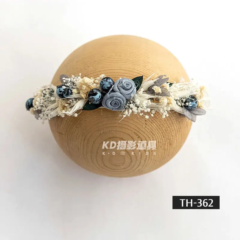 Adjustable faux flower headband for newborn photography, featuring delicate flowers and beads, perfect for baby girls aged 0-6 months.