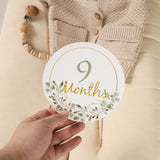 9-month milestone card featuring floral design, perfect for newborn baby photography and memory tracking.
